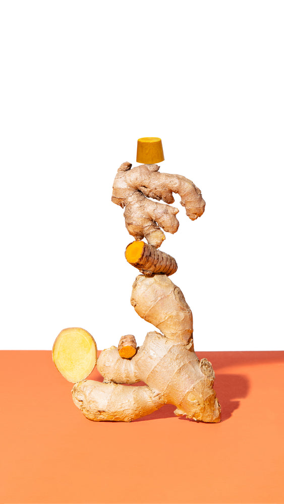 
                  
                    Load image into Gallery viewer, Ginger Turmeric Shot Ingredients Turmeric Ginger on White Harmony Root Rescue Wellness Package stack puck
                  
                